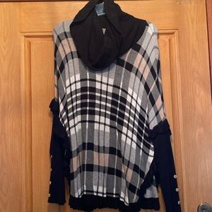 Cute poncho style sweater with button sleeve detail and ruffles on the bottom🖤